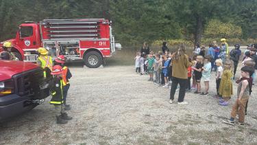 Students listening to a presentation from the Winlaw Fire Hall